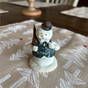 Charming Snowman Figurine with Black Hat and Green Vest